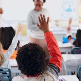 Students participating in a teacher-led classroom lesson